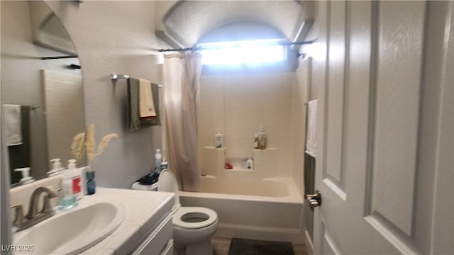 full bathroom with shower / bath combo, vanity, and toilet