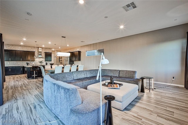 living room with light hardwood / wood-style flooring