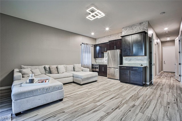 living room with light hardwood / wood-style floors