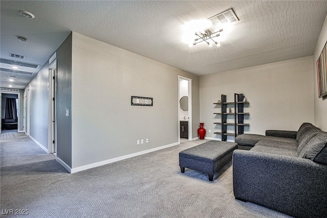 living room with carpet and a textured ceiling