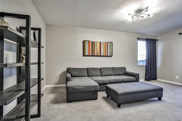 carpeted living room featuring a textured ceiling