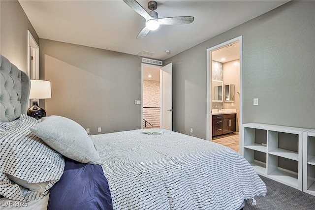 bedroom featuring ceiling fan and connected bathroom