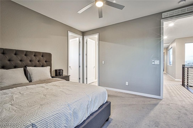 bedroom featuring ceiling fan and light carpet