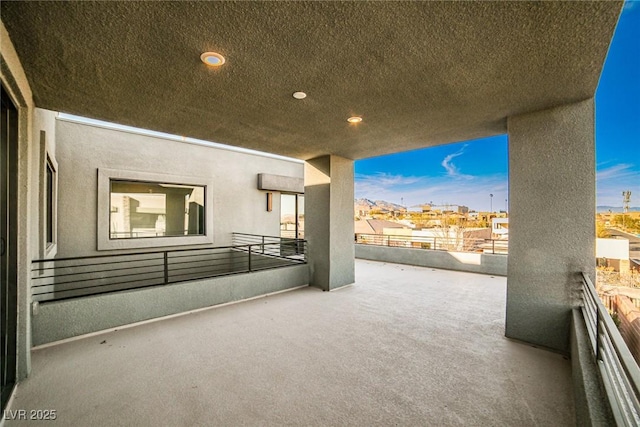 view of patio featuring a balcony