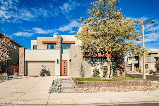 view of front of house featuring a garage and a balcony