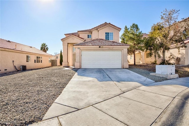 view of front of home with central AC unit and a garage