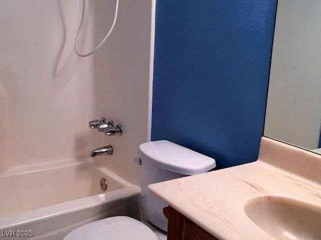 full bathroom with shower / washtub combination, vanity, and toilet