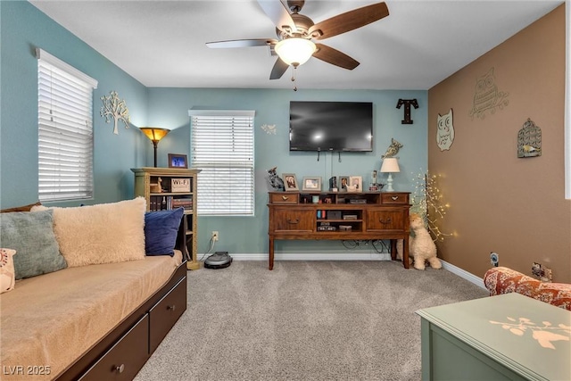 carpeted living room with ceiling fan