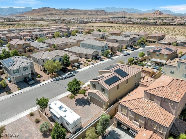 birds eye view of property featuring a mountain view