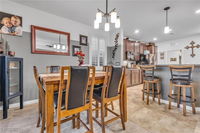 dining space featuring a chandelier