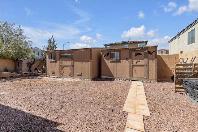 exterior space featuring a storage unit