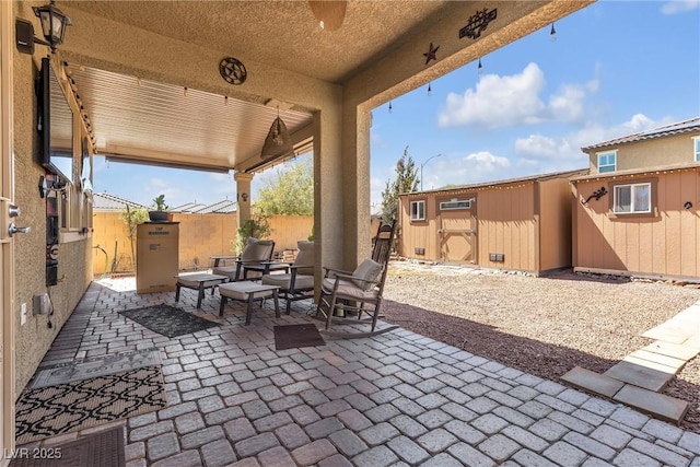 view of patio / terrace with a storage shed