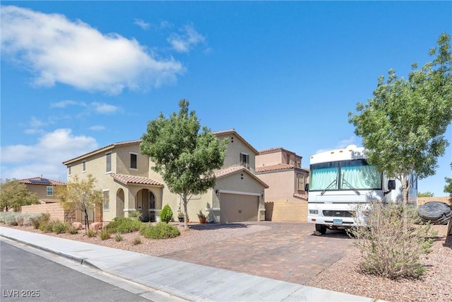 mediterranean / spanish house featuring a garage