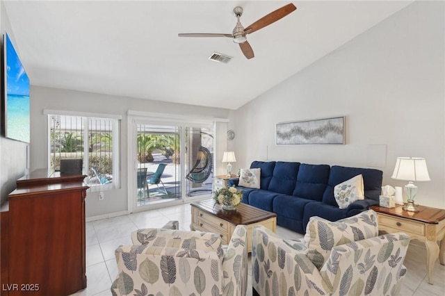 tiled living room with ceiling fan and lofted ceiling