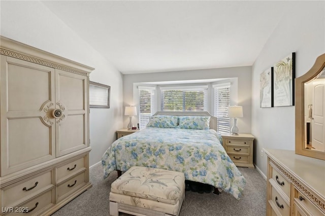 carpeted bedroom featuring vaulted ceiling