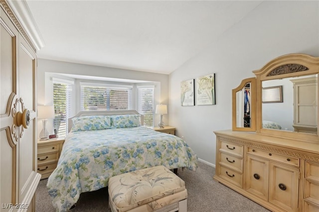 bedroom with light carpet and vaulted ceiling