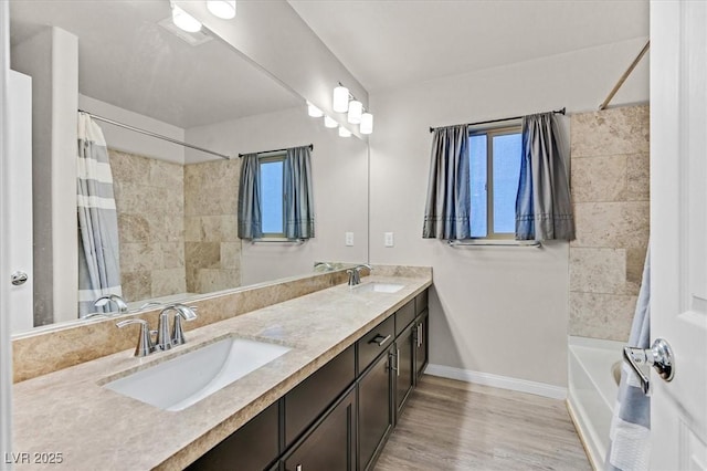 bathroom featuring hardwood / wood-style flooring, vanity, and shower / bath combination with curtain