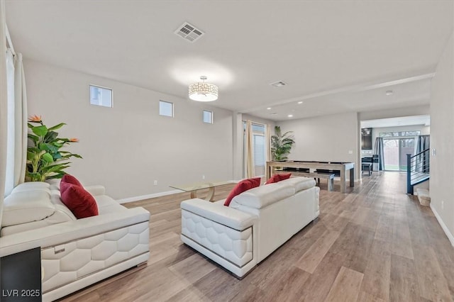 living room with light hardwood / wood-style flooring