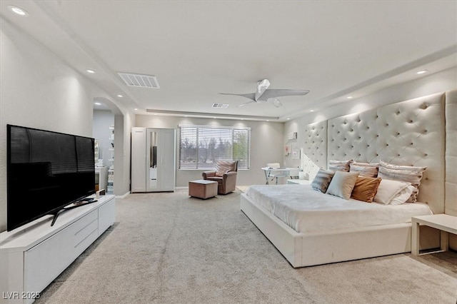 bedroom featuring ceiling fan and light carpet