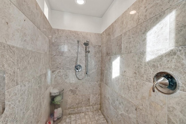 bathroom featuring tiled shower