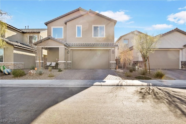 view of front of property with a garage