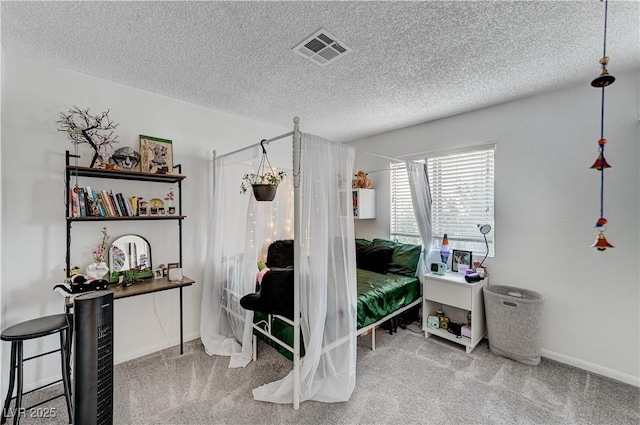 bedroom featuring carpet flooring and a textured ceiling