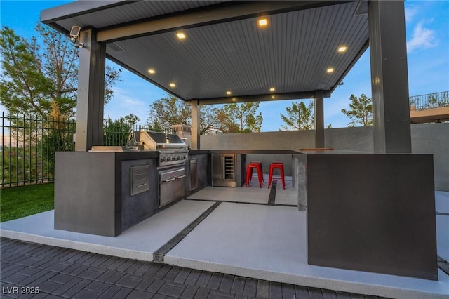 patio terrace at dusk with area for grilling