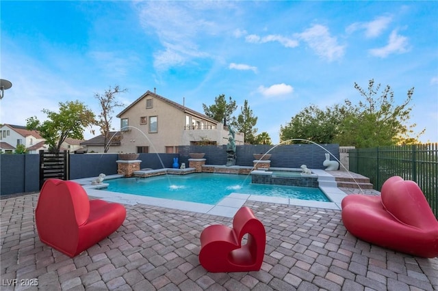 view of swimming pool featuring an in ground hot tub and pool water feature