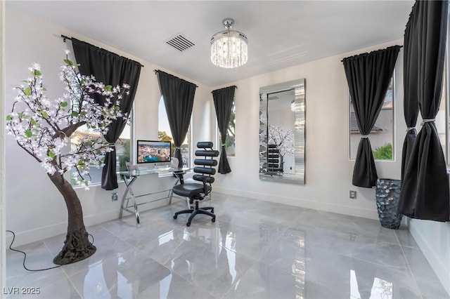 office area with a notable chandelier