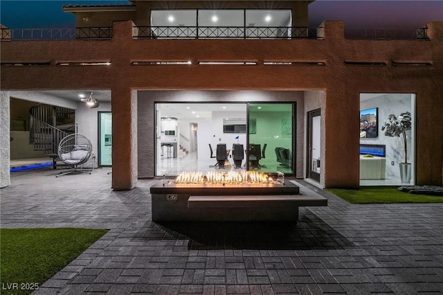 view of patio with a fire pit