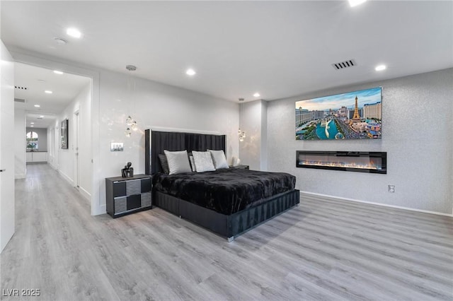 bedroom featuring wood-type flooring