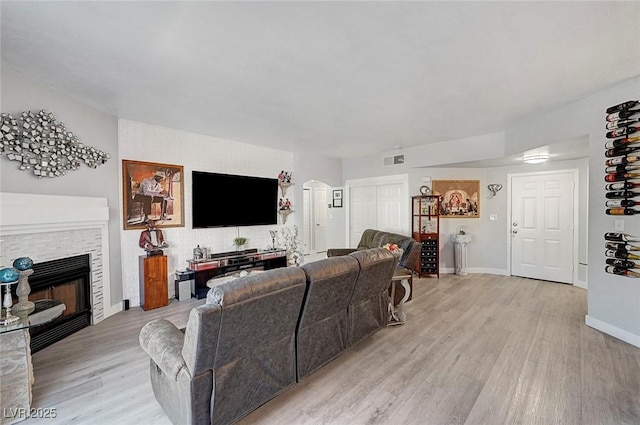 living room with light hardwood / wood-style floors