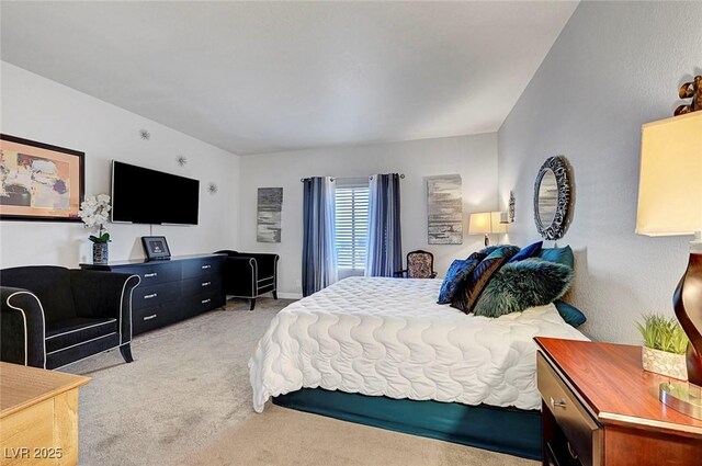 bedroom with light colored carpet