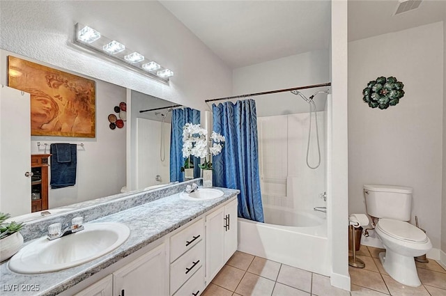 full bathroom featuring tile patterned flooring, shower / tub combo, vanity, and toilet