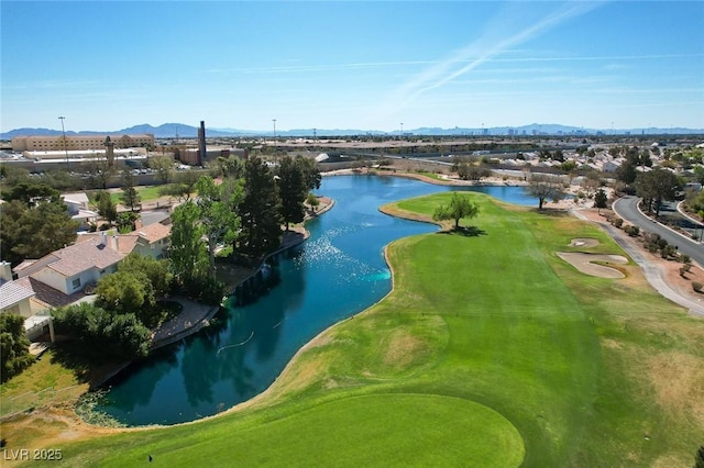 birds eye view of property with a water and mountain view