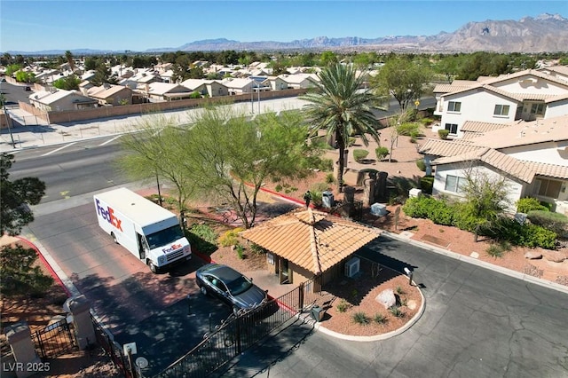 birds eye view of property featuring a mountain view