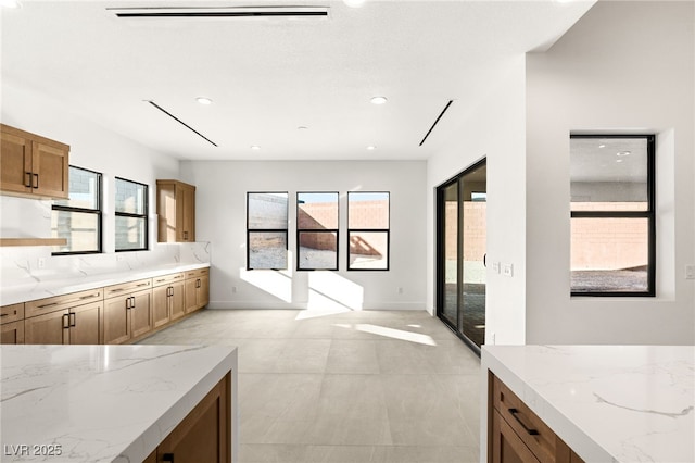 kitchen featuring light stone countertops