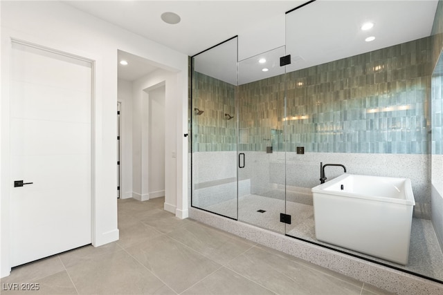 bathroom with tile patterned floors, plus walk in shower, and tile walls