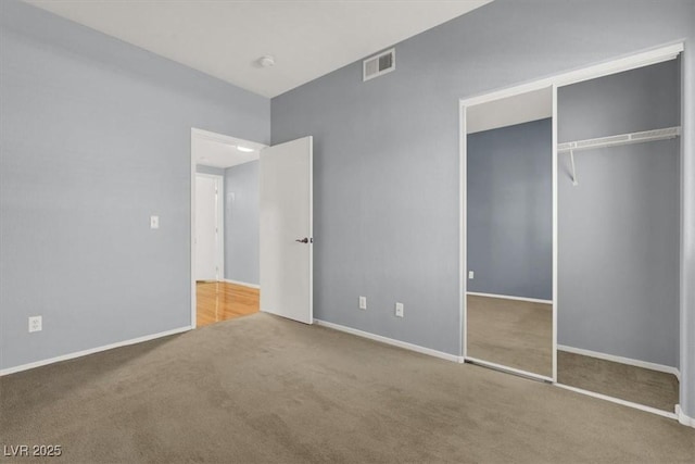 unfurnished bedroom featuring a closet and carpet