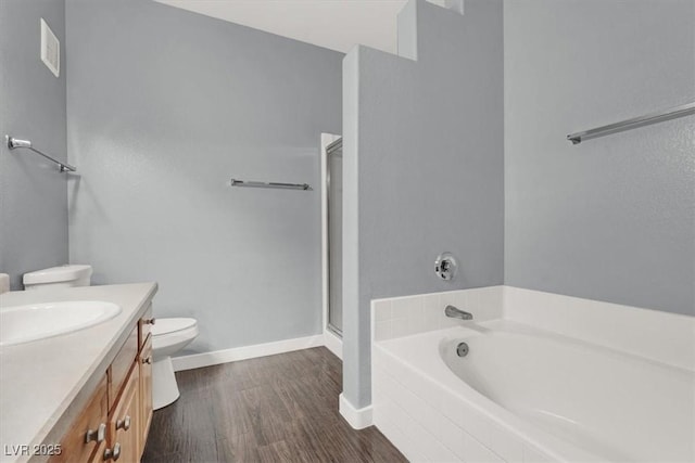 full bathroom featuring vanity, toilet, wood-type flooring, and independent shower and bath