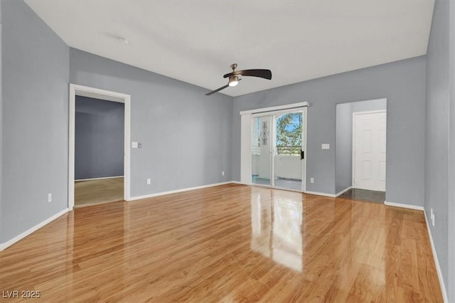 empty room featuring light wood-type flooring and ceiling fan