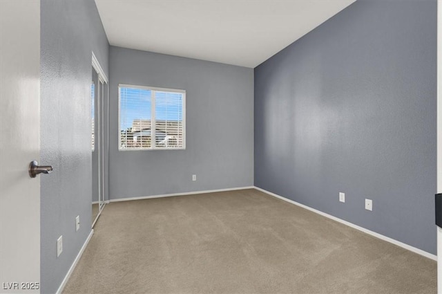 empty room featuring carpet flooring