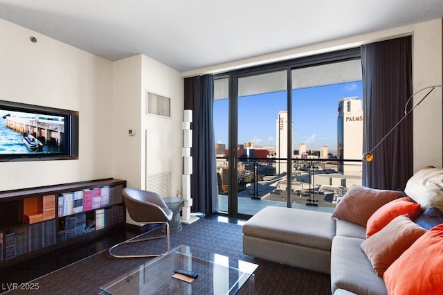 living room featuring floor to ceiling windows