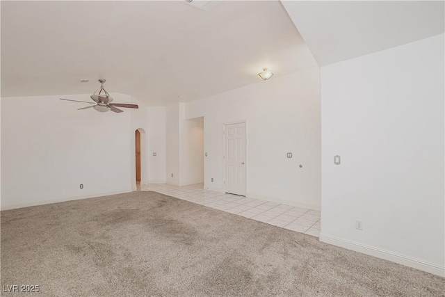 carpeted spare room featuring ceiling fan