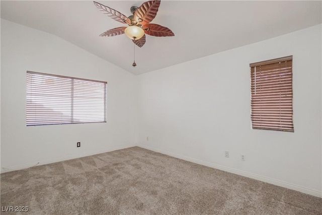 unfurnished room with ceiling fan, lofted ceiling, and light carpet