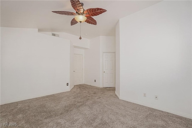 unfurnished room with ceiling fan, light colored carpet, and lofted ceiling