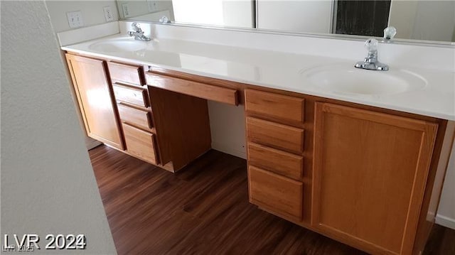 bathroom with hardwood / wood-style floors and vanity