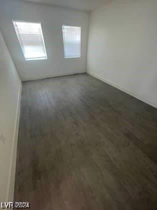 spare room featuring dark hardwood / wood-style floors