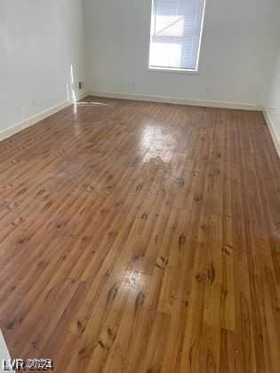 spare room with hardwood / wood-style floors