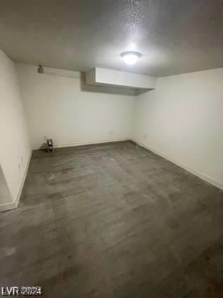 basement with a textured ceiling